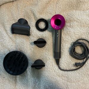 Does not say Dyson.  Everything is the same. No brand name no barcodes